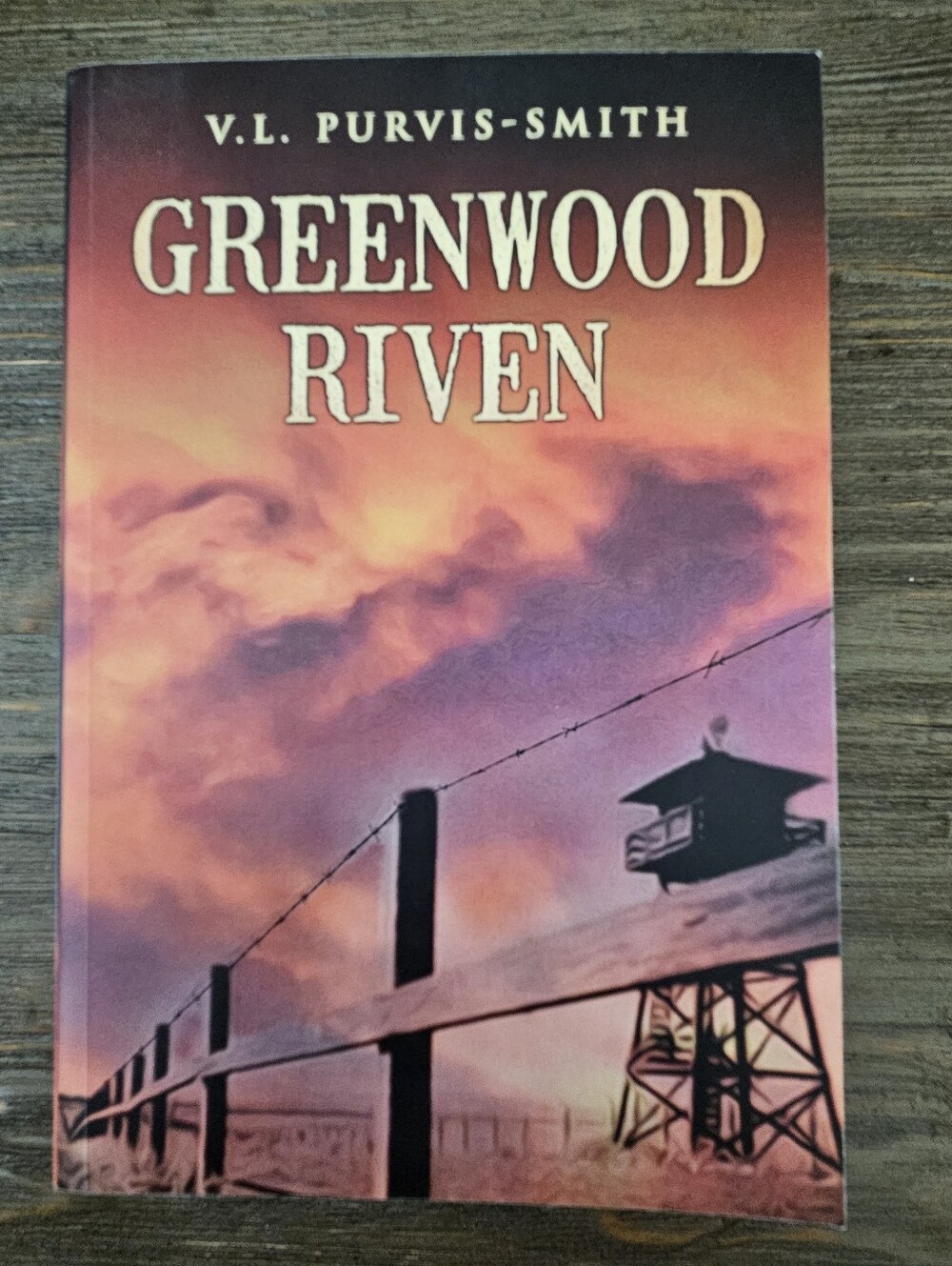 Signed paperback book titled "Greenwood Riven" by V.L. Purvis-Smith